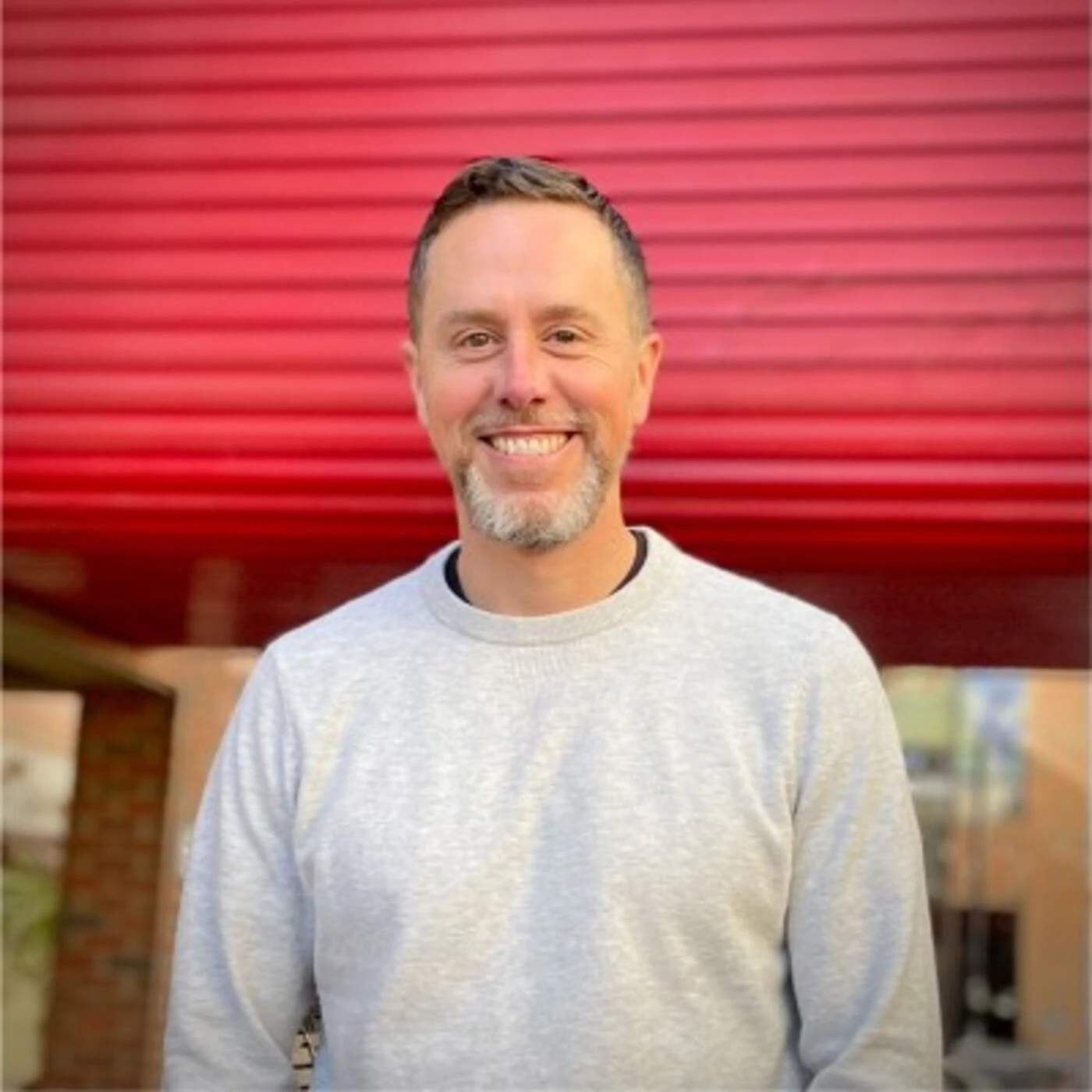 Heatspring cofounder Brian Hayden smiling in professional outdoor headshot