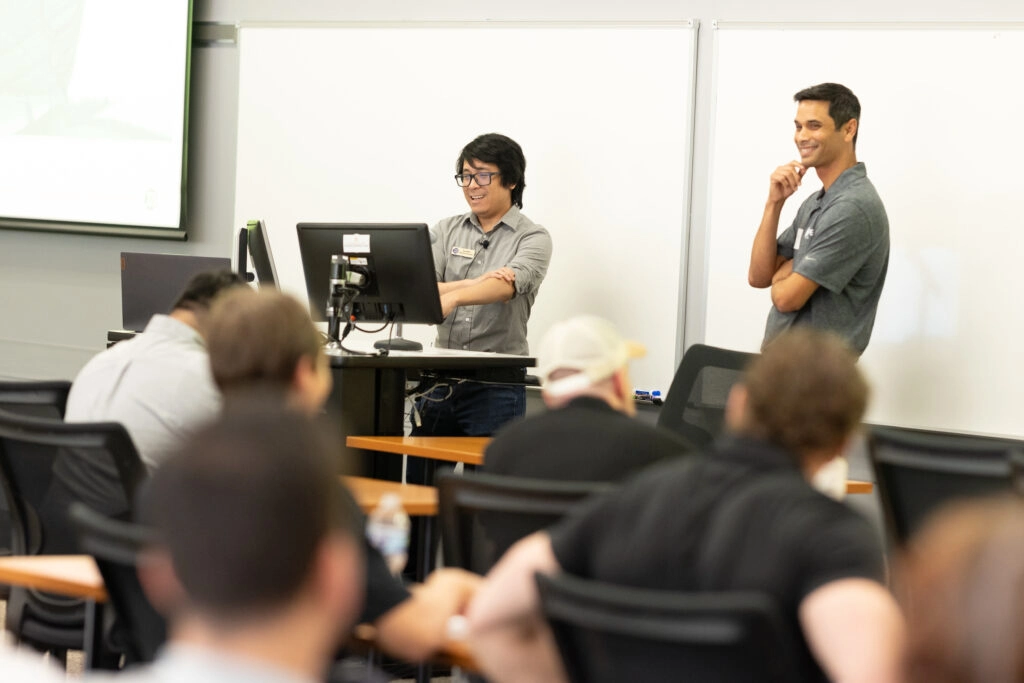 Instructors present to audience during interactive classroom training or technical workshop
