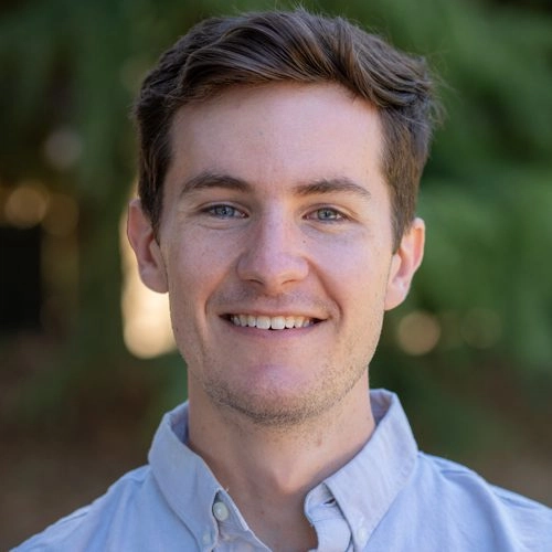 Senior engineering consultant at Mayfield Renewables smiling in outdoor headshot